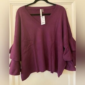 Ny collection brand purple sweater with bell sleeves. Length is 23inches. NWT